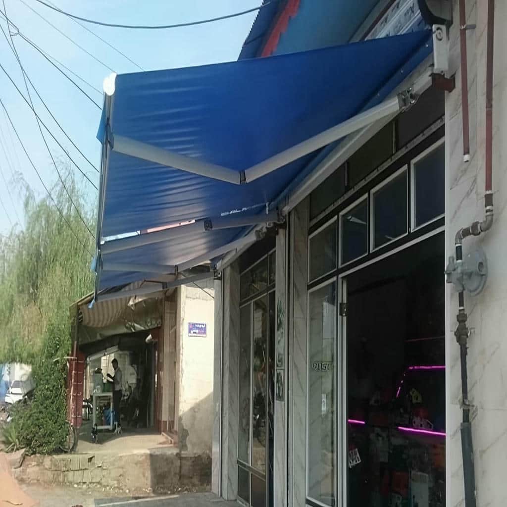 سایبان برقی مجهز به سنسور باد و باران با حفاظت پارچه سایبان برقی مجهز به سنسور باد و باران با حفاظت پارچه