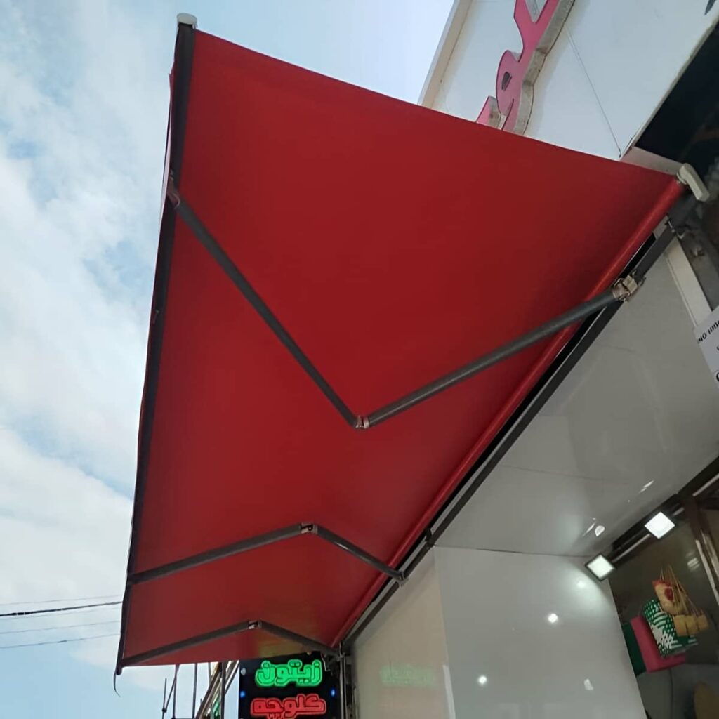 سایبان بازویی رشت با پوشش طوسی گسترده