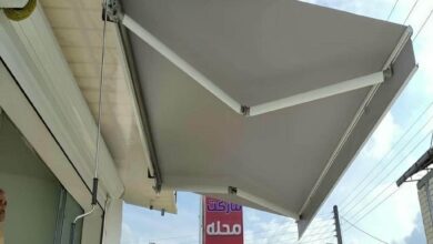 سایبان برقی بیرجند با پوشش طوسی ورودی ساختمان